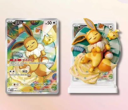 Eevee sleeping figure with matching holographic Eevee card